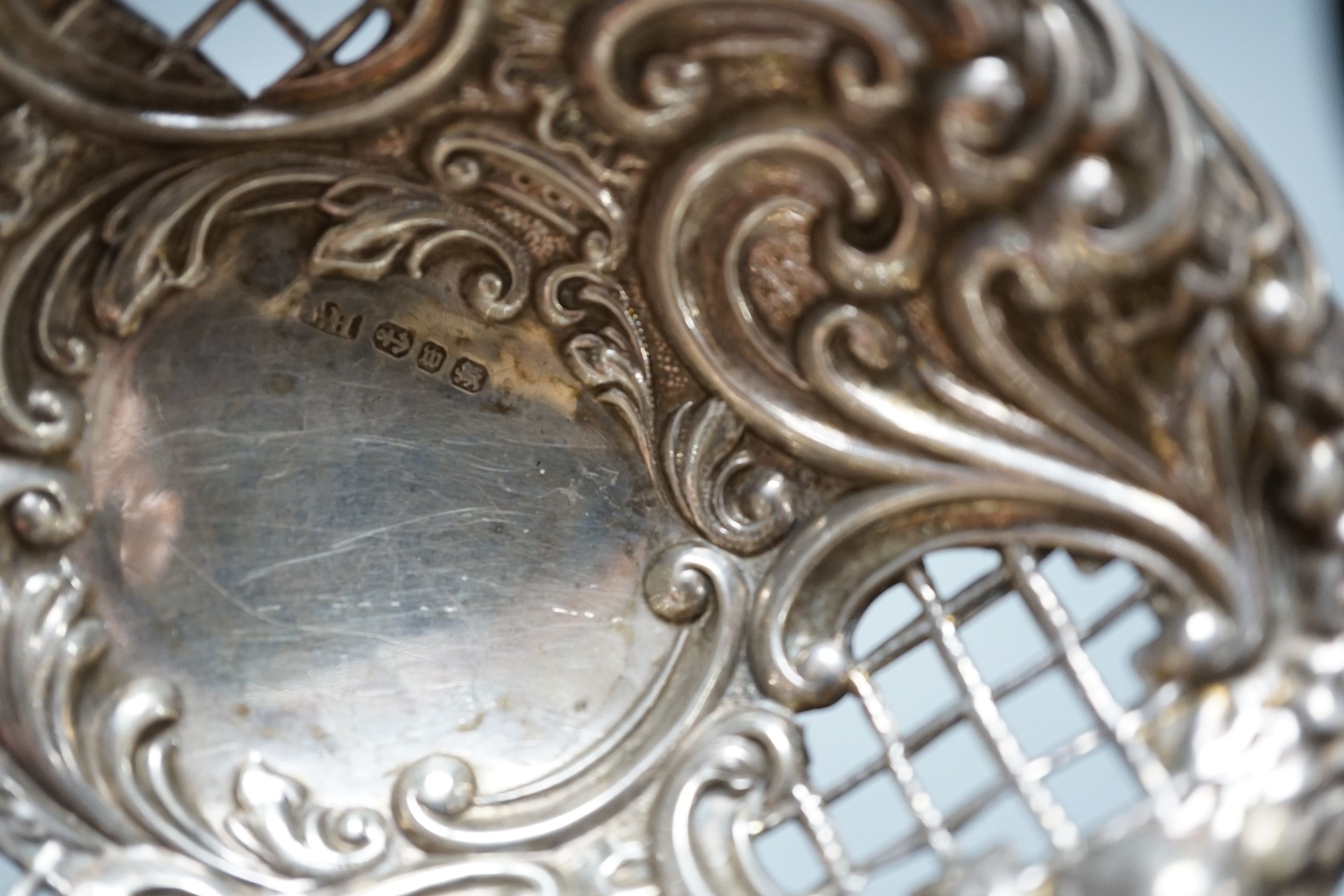 A cased Victorian silver part communion set, a silver cigarette case, two silver napkin rings, a set of five pierced silver bonbon dishes, a pair of Victorian silver grape shears, Georgian silver vinaigrette, pair of sil